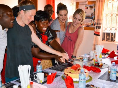 Guests & Adonai staff cut a cake